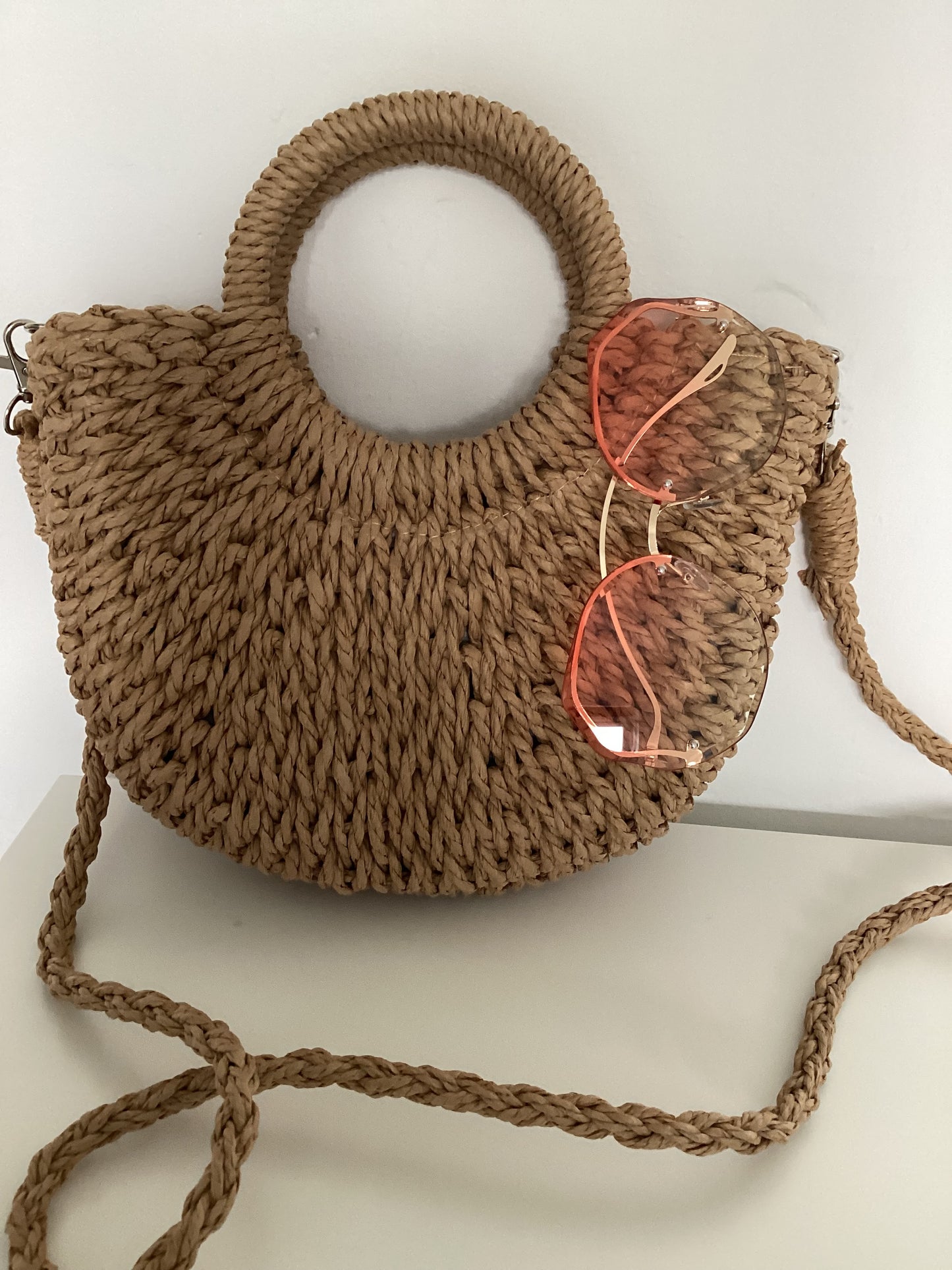 Handmade strawrattan half moon bag with handles and rose tint sunglasses