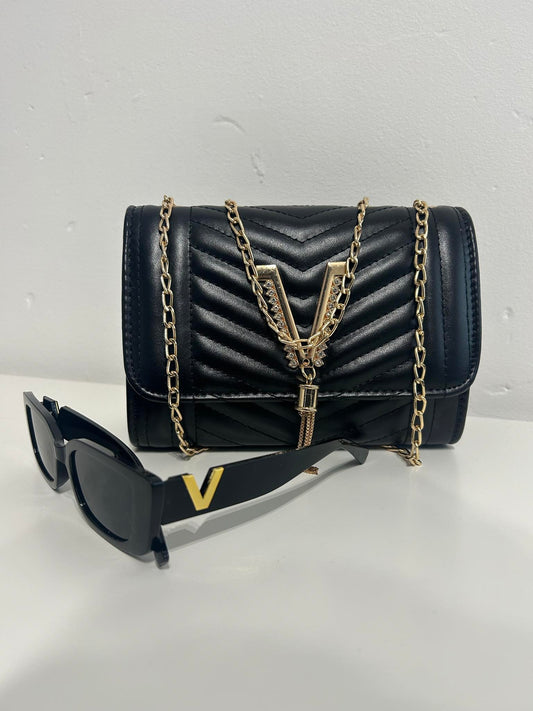 Black and gold vintage inspired crossover handbag with matching sunglasses