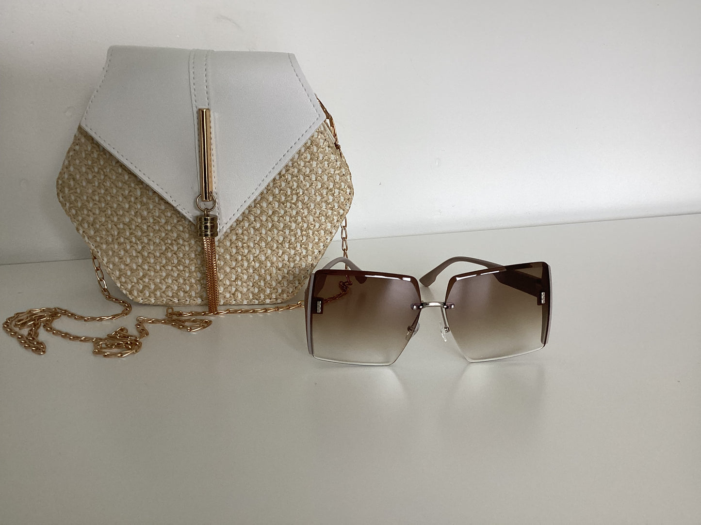 Hexagon straw crossover bag with large square sunglasses